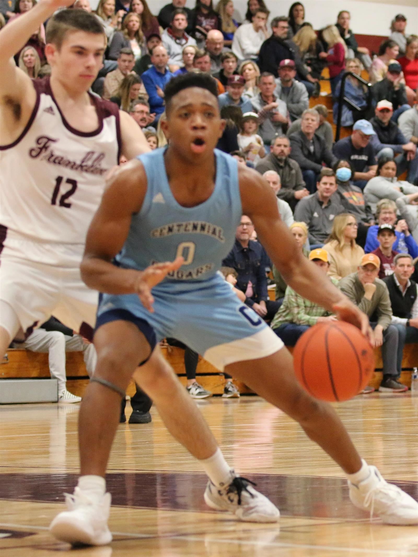Male basketball player dribbling